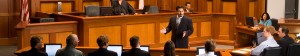 A lawyer talks to members of the jury.
