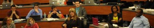 Law students sitting in class listen to a fellow classmate.
