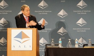 Peter Edelman standing behind podium