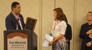 Jayesh Rathod presents award to JoNel Newman