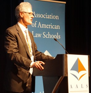 John Nethercut, Executive Director of the Public Justice Center in Baltimore standing at podium