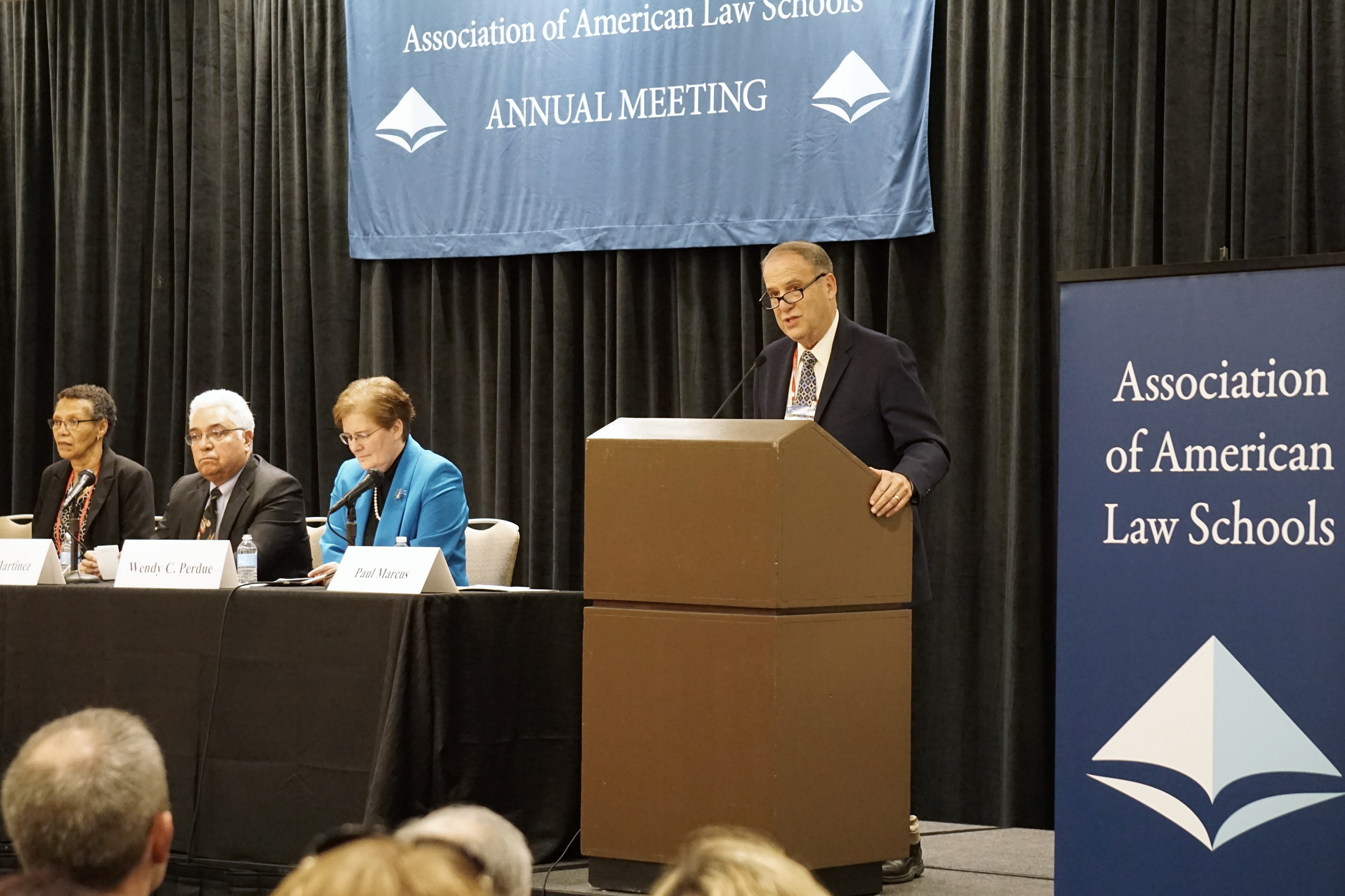 2017 AALS President Paul Marcus, William & Mary Law School, addresses the House of Representatives during the First Meeting along with Ginger Patterson, AALS Associate Director; Leo Martinez, University of California, Hastings College of the Law; and 2018 AALS President Wendy Perdue, Dean, University of Richmond School of Law
