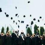 Successful graduates in academic dress