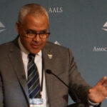 Mark Alexander speaking at a podium