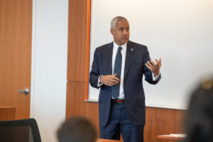 Mark Alexander speaking in front of a room