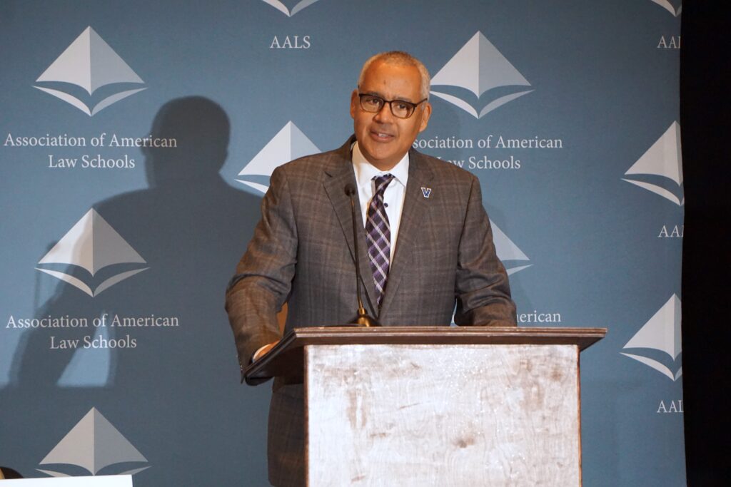 Mark Alexander delivers address at podium in front of AALS backdrop