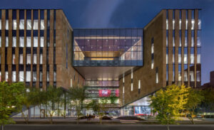 modern glass and tile building with large windows in the center