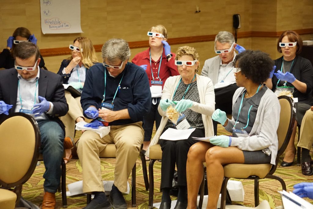 Attendees participating in an exercise during the session "Teaching Empathy to Millennials for These Tumultuous Times."