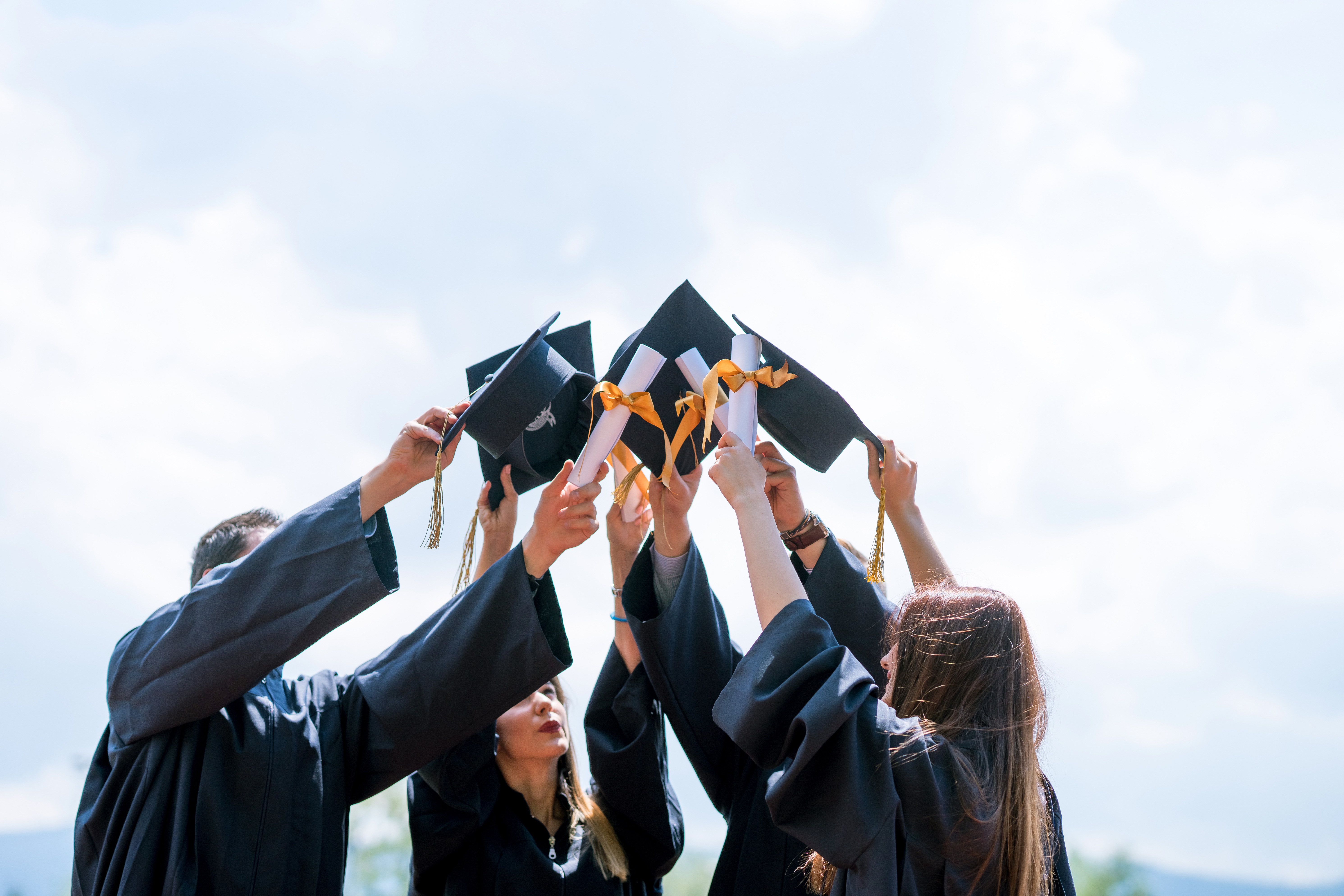 Successful graduates in academic dress