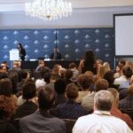 NLT 2024 Panel with a speaker, taken from the back of the crowd